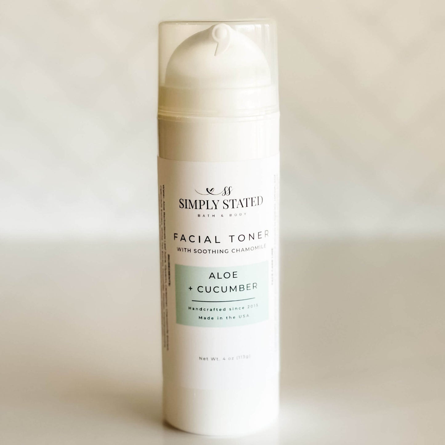Simply Stated Facial Toner in Aloe + Cucumber, 4oz airless pump bottle, soothing botanical hydration for all skin types.