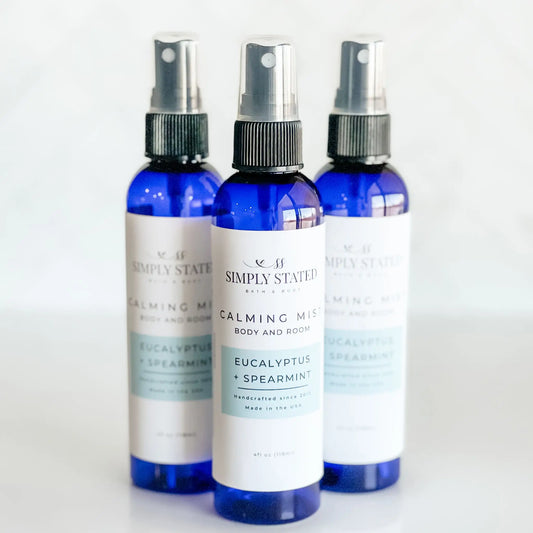 Three bottles of Simply Stated Calming Mist with Eucalyptus and Spearmint on a white background