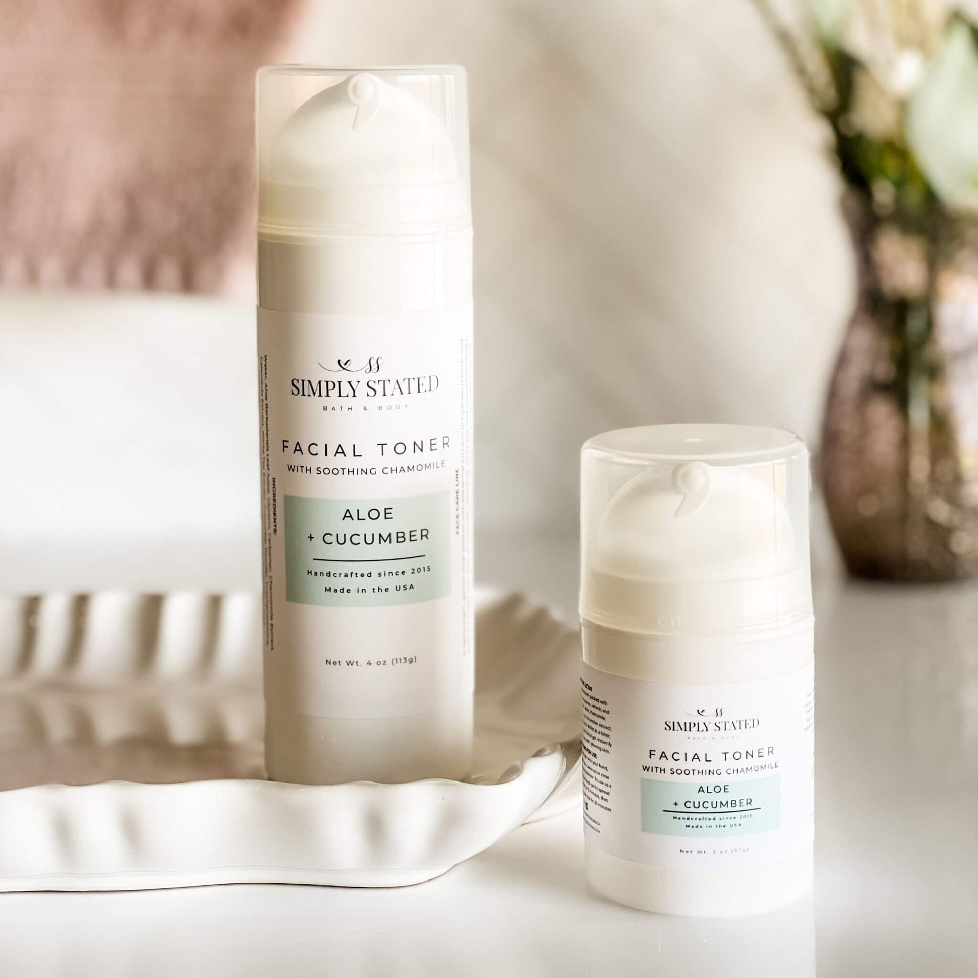 Simply Stated Facial Toner in Aloe + Cucumber, available in 4oz and 2oz airless pump bottles, lightweight hydrating formula.