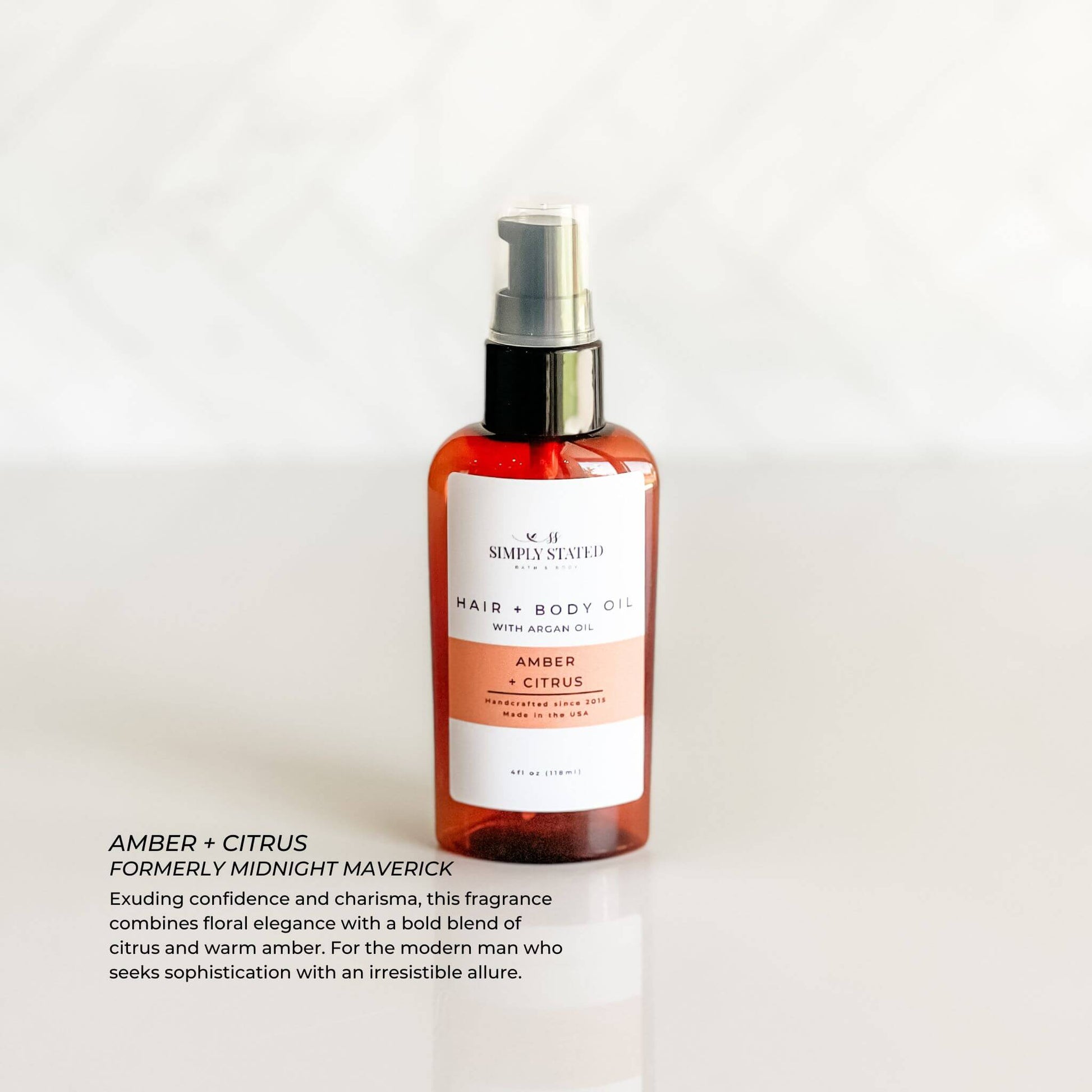 Amber + Citrus Men’s Beard + Body Oil in amber bottle with black pump