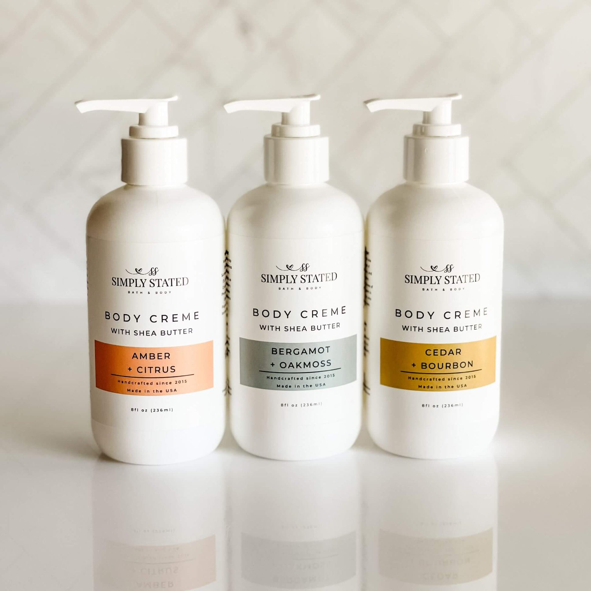 Group of 8 oz pump bottles from Simply Stated’s men’s line in three signature scents.