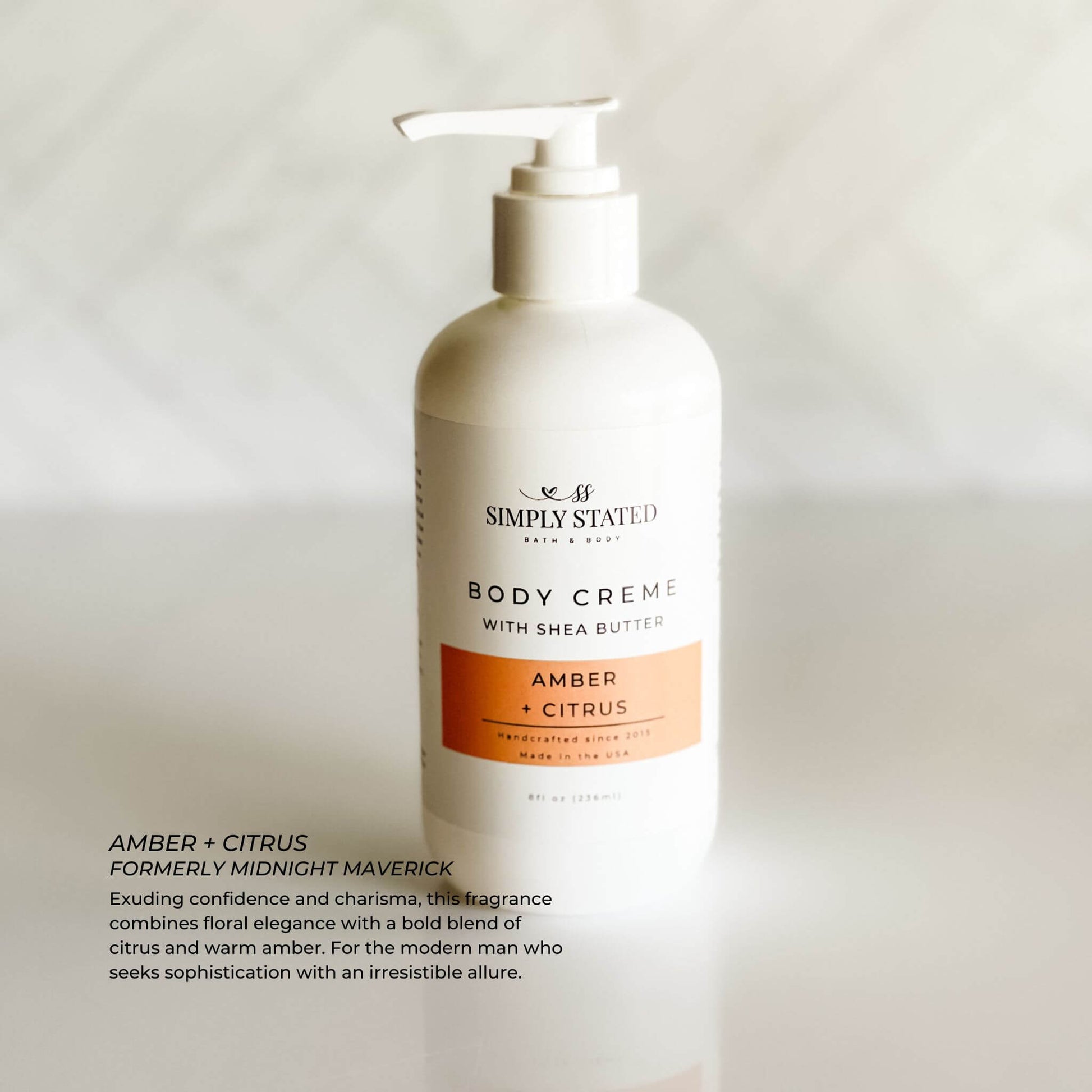 Amber + Citrus body creme in 8 oz pump bottle, minimalist design for men.