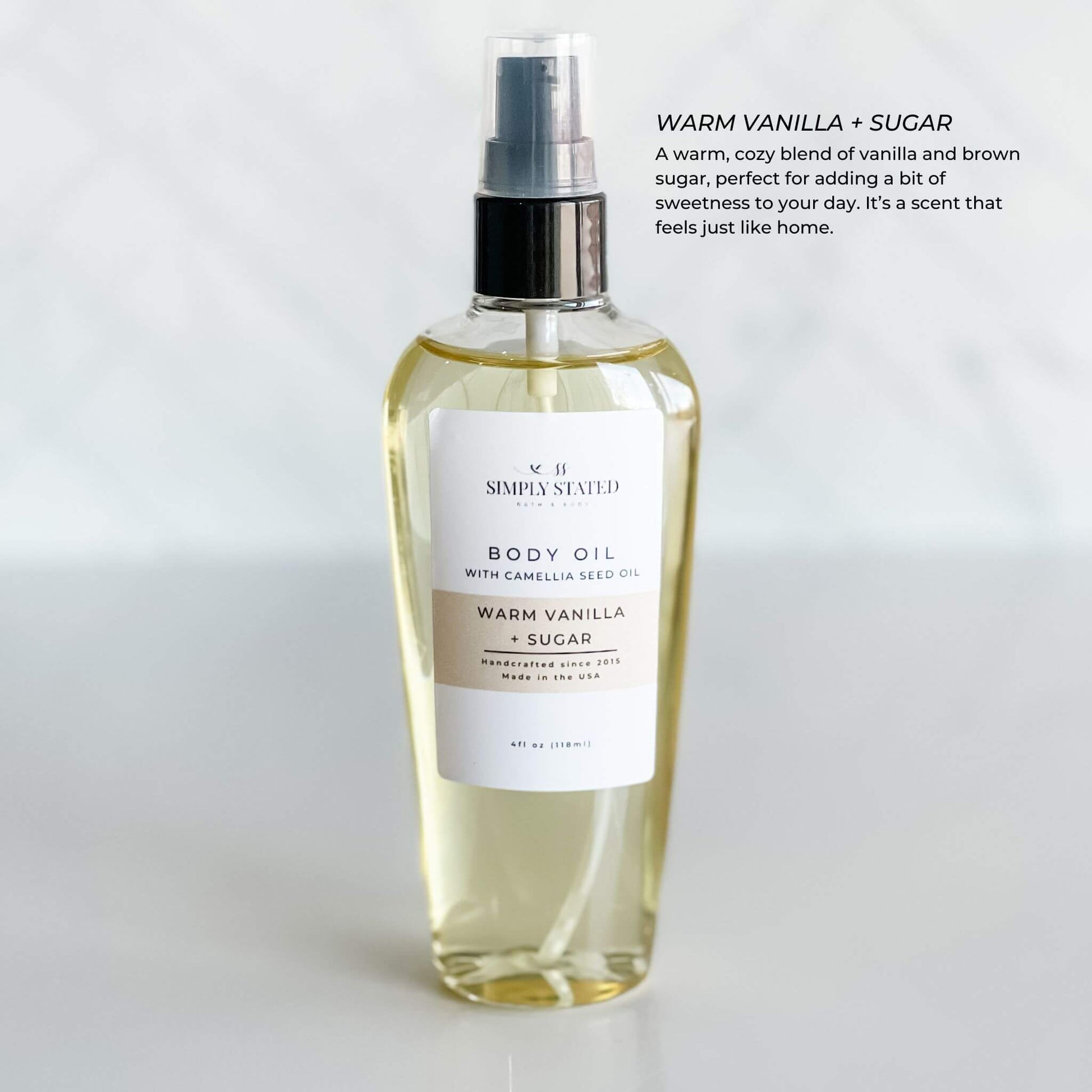 Simply Stated Bath & Body's Warm Vanilla + Sugar Body Oil in a 4oz bottle. Indulge in a cozy, sweet vanilla and brown sugar scent that nourishes your skin.