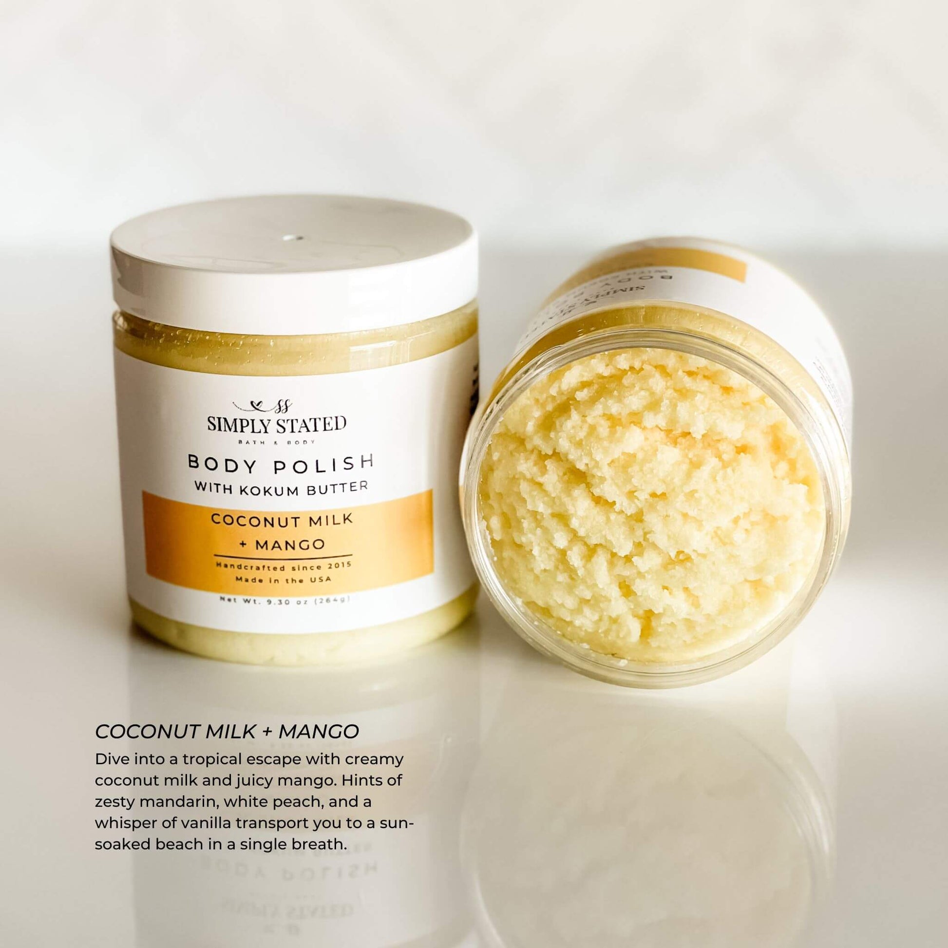 Simply Stated Body Polish in Coconut Milk + Mango scent, a creamy exfoliating scrub with kokum butter, offering hints of mandarin, white peach, and vanilla for a tropical escape. 9.3 oz jar with updated label design.