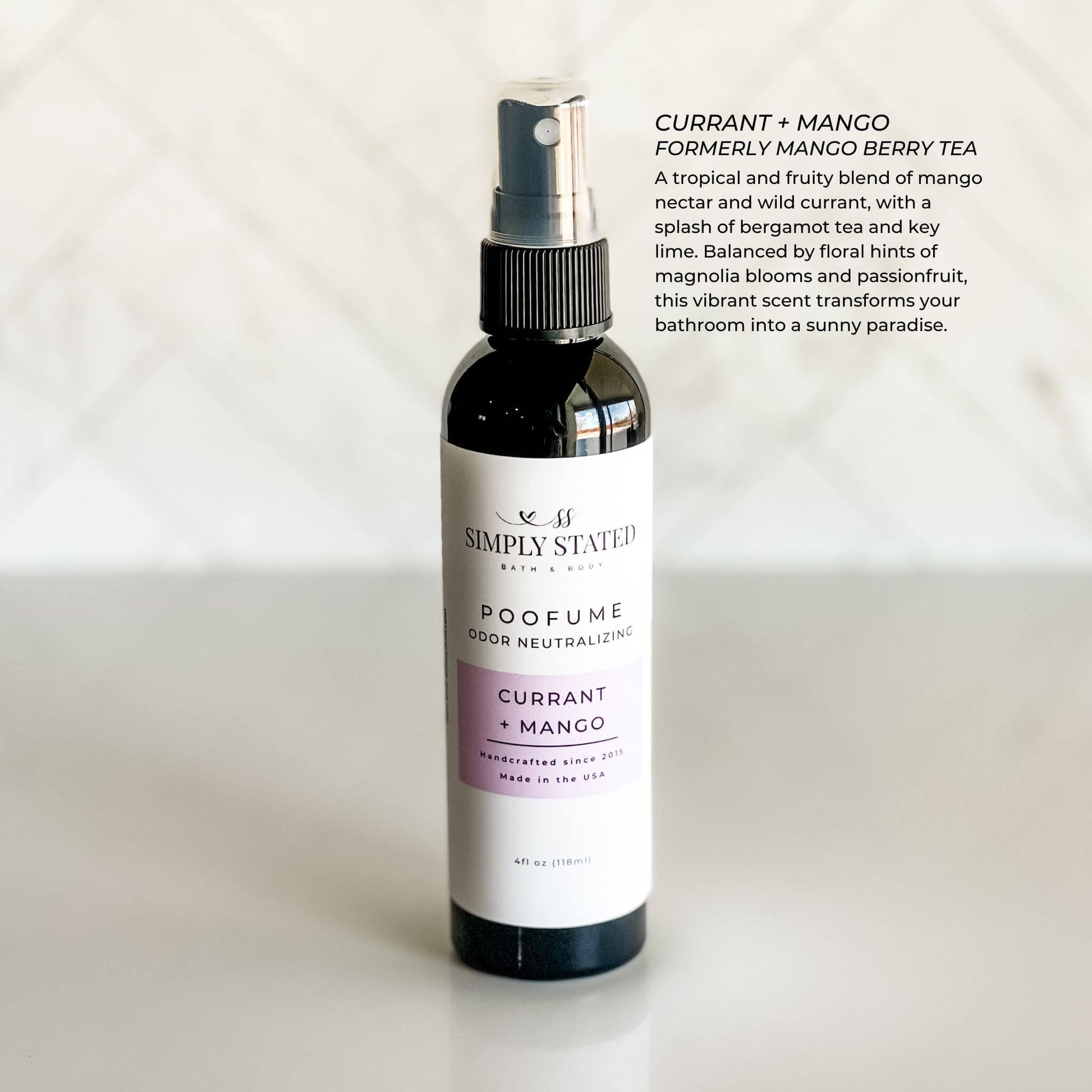 Sweet and tropical currant + mango scent Simply Stated Poofume in a 4oz black spray bottle.