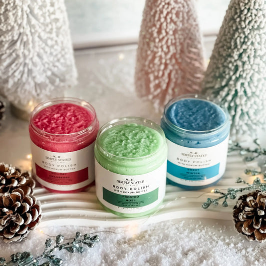 Three jars of body polish with decorative elements on a white surface.
