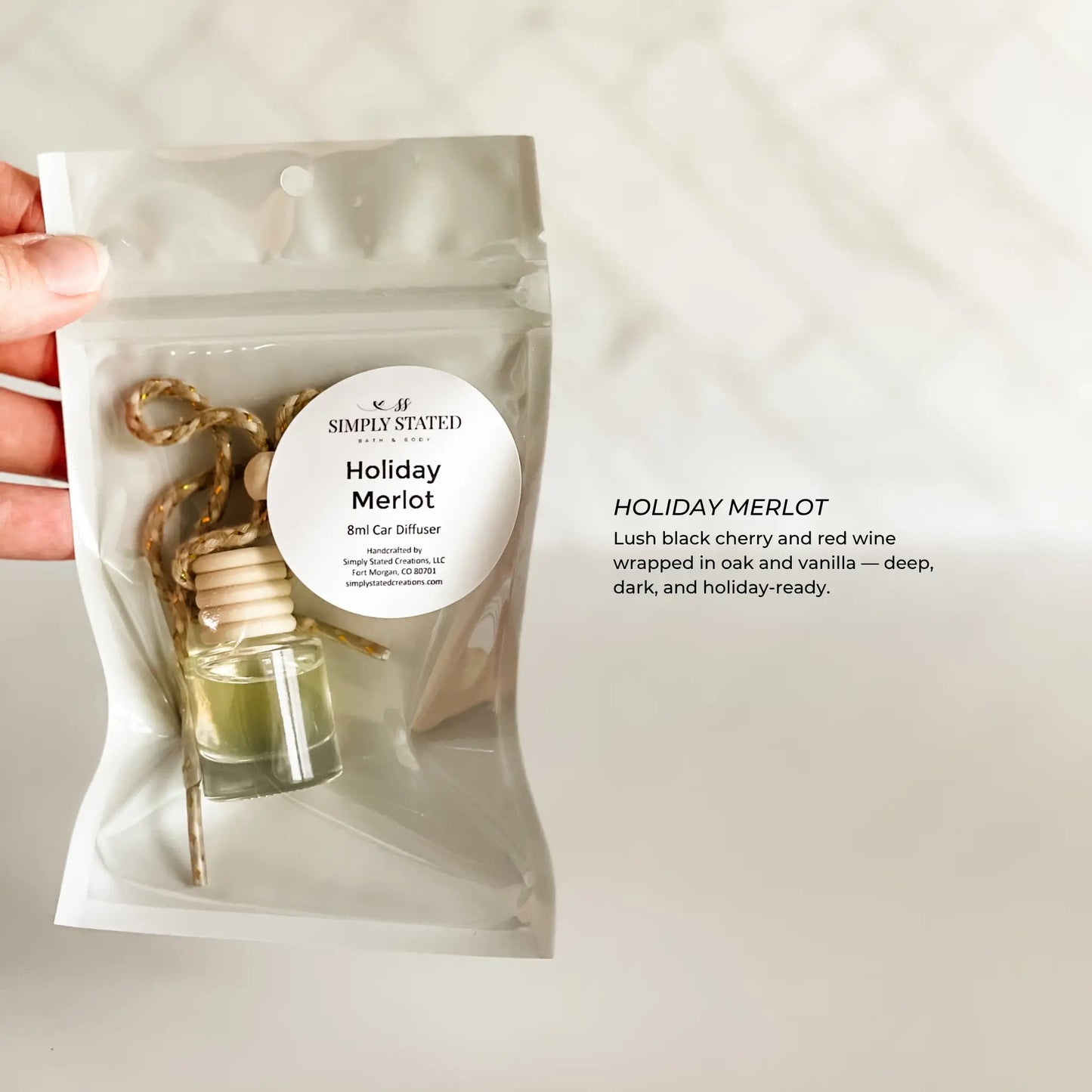 Small bottle diffuser in a clear packaging with a label on a light background