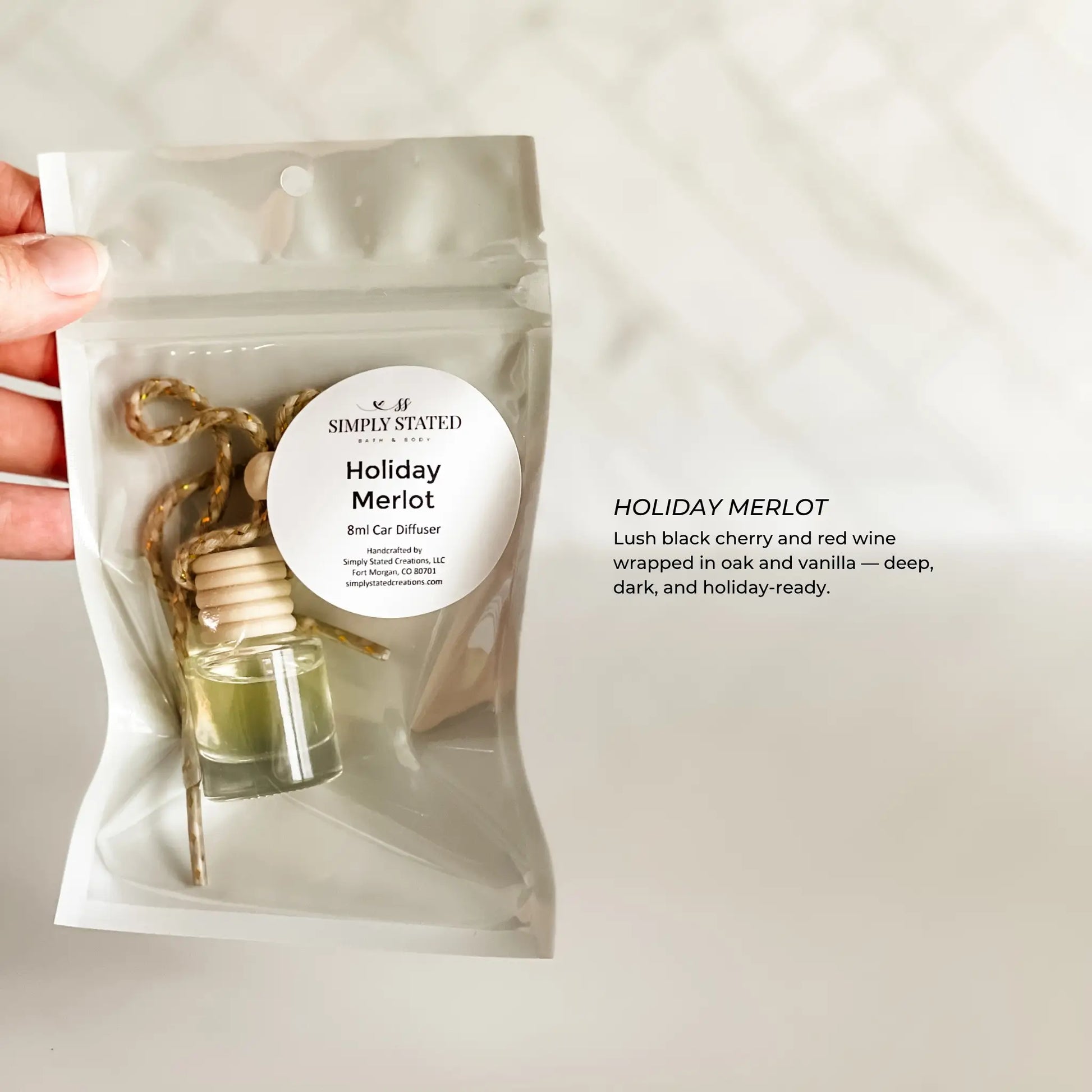 Small bottle diffuser in a clear packaging with a label on a light background